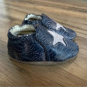 Robeez soft soles baby shoe, size 0-6mo, color navy blue with silver stars.